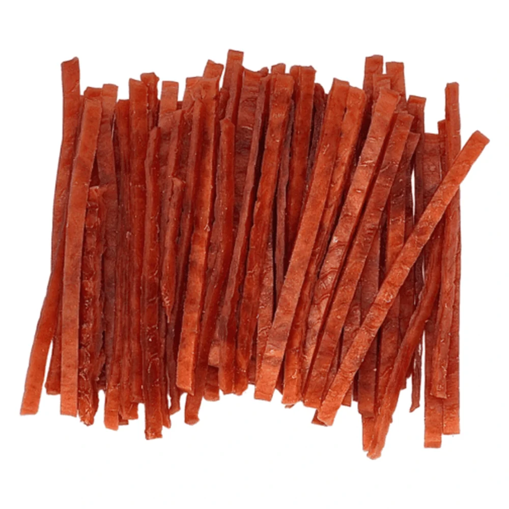 HAPPY SNACKY MIĘKKIE PASKI Z KACZKI 500G – zbliżenie produktu HAPPY SNACKY MIĘKKIE PASKI Z KACZKI 500G – zbliżenie na białym tle